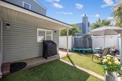 View of yard with a trampoline