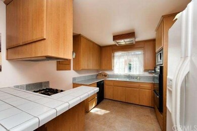Refaced kitchen cabinets with new doors and drawer