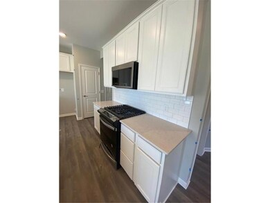 Quartz Counters with 42 Inch White Maple Cabinets
