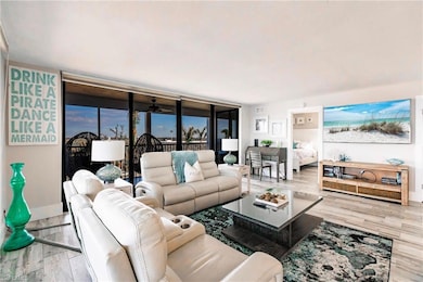 Living room with light hardwood / wood-style floor