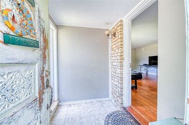 Entry with view into living room.