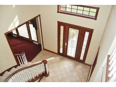Entry/Foyer. Curved staircase greets you as you en