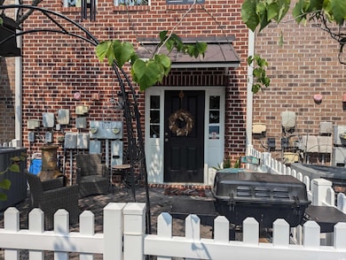 Entrance to property with brick siding