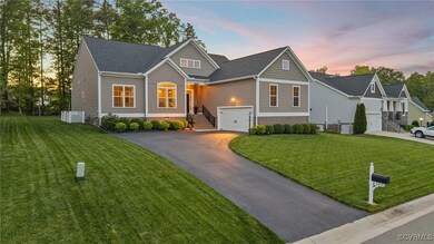 Craftsman-style home with a yard, driveway, and a
