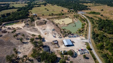 Birds eye view of property with a rural view