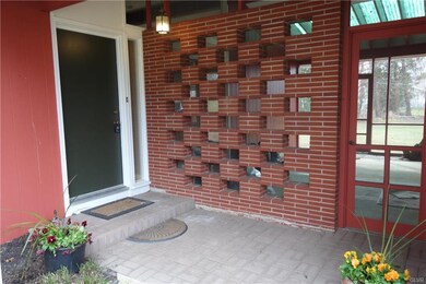 Front door entry with unique style breezeway that 