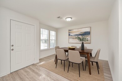 This virtually staged picture highlightings the room’s spacious layout and natural light