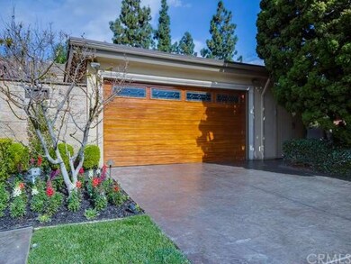 The custom mahogany hardwood roll-up garage door f