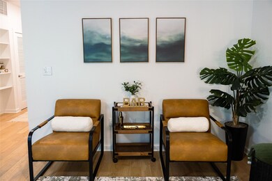 Sitting room with light wood finished floors and baseboards