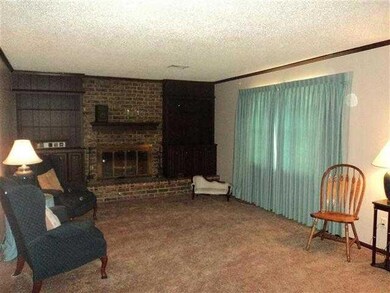 Living Room. Living room w/ fireplace and built in