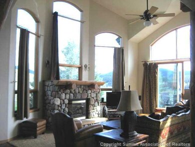 Living Room. Dramatic arched windows accent specta