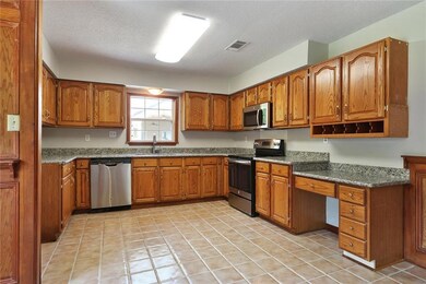 Kitchen offers new slab granite and stainless appl