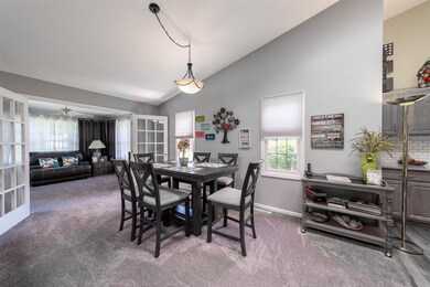 Dining area leading into four season room.