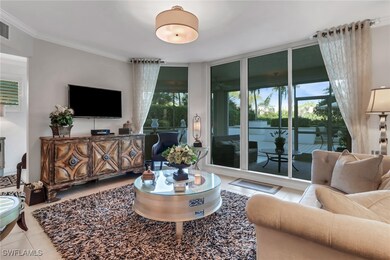 Tiled living room with crown molding and a healthy