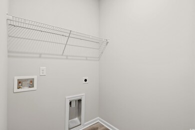 Washroom featuring hookup for a washing machine, w