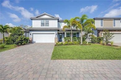 View of front of property with a garage, decorativ