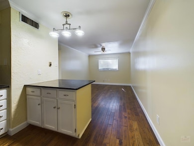 Kitchen featuring a peninsula, ornamental molding