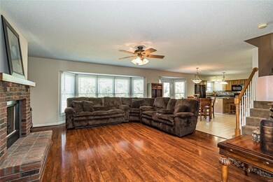 Five Bay Window overlooking Tree Lined Backyard