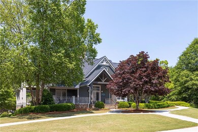 View of front of property with a front yard and a porch