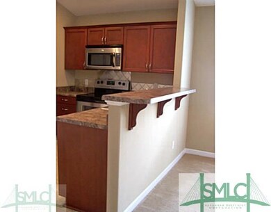 Kitchen. Raised bar area is great for buffet style