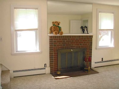Living Room. Wood burning brick fireplace.