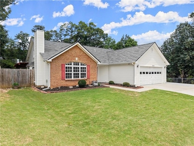 Ranch-style house featuring brick siding, driveway, an attached garage, a chimney, and a shingled roof