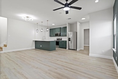 Kitchen featuring decorative backsplash, an island
