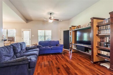 Large family room with wood floors.