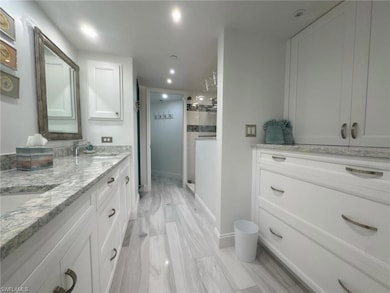 Master bathroom featuring recessed lighting, a sin