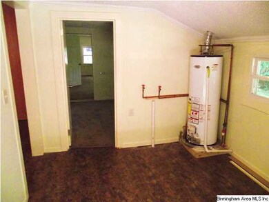 Utility and laundry room with new gas water heater