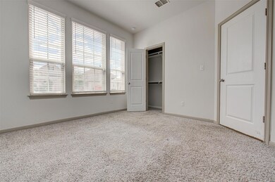 Unfurnished bedroom featuring carpet flooring, ba