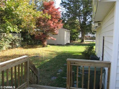 Exterior Back - Level .32 Acre Lot