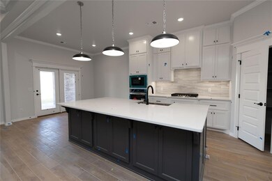 Kitchen with light wood-type flooring, a spacious 
