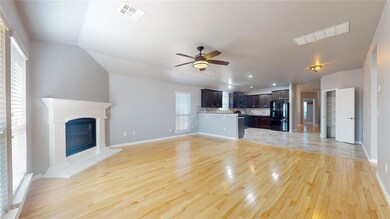 Open living room with light tile flooring, ceiling