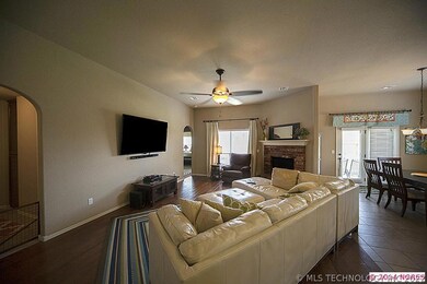 Wide open great room with cozy brick fireplace
