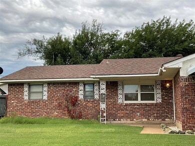Ranch-style home with a front yard