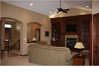 Open living room boasts a vaulted ceiling and uniq