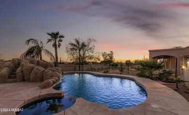 Pool waterfall, spa, and slide