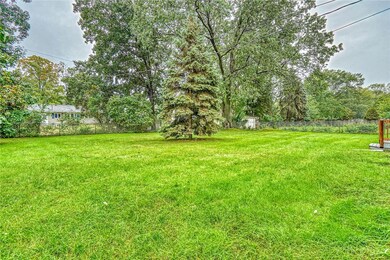 VIEW OF THE FENCED-IN BACKYARD