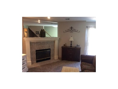 Living room with gas start fireplace.