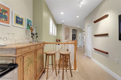 Bar featuring a bar, recessed lighting, baseboards