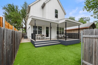 Rear view of property featuring board and batten 