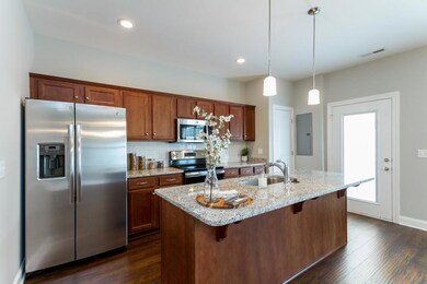 Kitchen with Granite, No Tile Backsplash. Full Stainless Steel Appliance Package