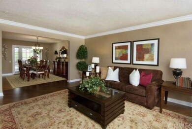 Adjoining dining room has French doors that open u