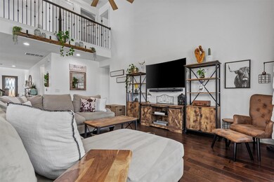 Living room featuring hardwood / wood-style floor