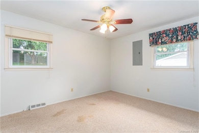 Master bedroom with an attached half bath.