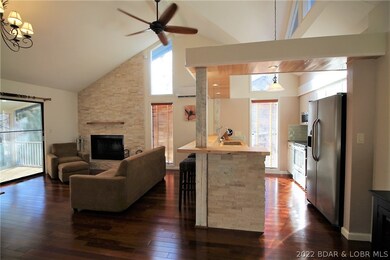 Kitchen open to LR w/beautiful rock accent.