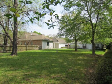 Oversized shaded lot nicely landscaped