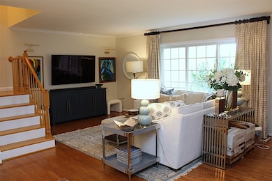 Living Room features hardwood flooring and sliding door out to outdoor patio.