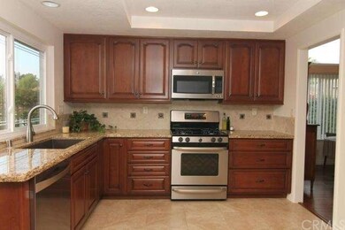 Stone back splash, gas stove, microwave and dishwa